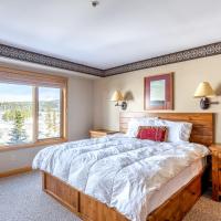 a bedroom with a large bed and a window at Shoshone Condo 1957, Big Sky