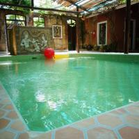 a swimming pool with a ball in the water at Sala Done Khone Hotel, Don Khone