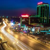 a city lit up at night with traffic on a highway at Hotel Korston Royal Kazan