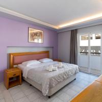 a bedroom with a bed with two candles on it at N E P center Hotel Rodos, Rhodes Town