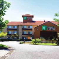 a large building with a sign for a hotel at Holiday Inn Express Portland East - Columbia Gorge, an IHG Hotel, Troutdale
