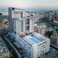 an overhead view of a city with tall buildings at Radisson Blu Hotel, Larnaca