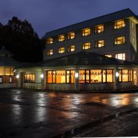 a building at night with its lights on at Hotel Oak Forest, Hakuba