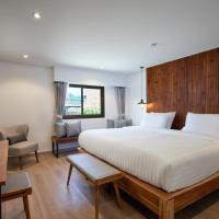 a bedroom with a large white bed and a desk at P2 Wood Loft, Phi Phi Islands