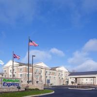 a building with two american flags in front of it at Holiday Inn Express - Columbus - Dublin, an IHG Hotel