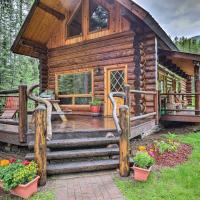 a log cabin in the woods with a porch and stairs at Cozy Glacier Park Log Cabin - Best in the West!, Essex