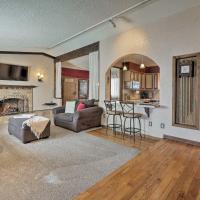 a living room with a couch and a fireplace at Arvada Home with Deck and Game Room Near Olde Town!