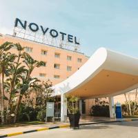 a novation hotel in front of a building at Novotel Cairo 6th Of October