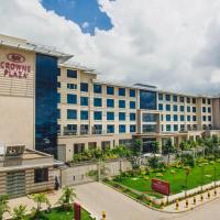 a large building with a park in front of it at Crowne Plaza Nairobi Airport, an IHG Hotel