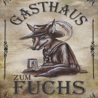 a sign with a deer with a hat and aries at Gasthaus zum Fuchs - Familie Andrä, Hermagor