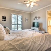 a bedroom with a large bed with a ceiling fan at Upscale Home with Seasonal Pool Near Historic Rte 66, Vinita