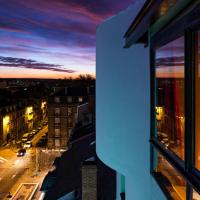 a view from a window of a city at dusk at Holiday Inn Reims Centre, an IHG Hotel