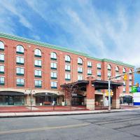 a large brick building on the corner of a street at Holiday Inn Express Hotel & Suites Pittsburgh-South Side, an IHG Hotel