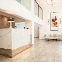 a lobby with a marble counter and a couch at Roseum Boutique Hotel, Larnaca