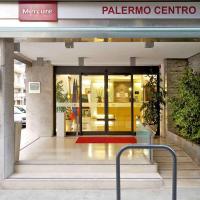 a entrance to a building with a revolving door at Mercure Palermo Centro