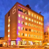 a tall building with a purple light on it at Hotel SiX, Kreuzlingen