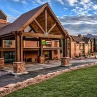 a lodge with a large building with a roof at Holiday Inn Express Springdale - Zion National Park Area, an IHG Hotel