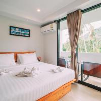 a bedroom with a bed with white towels on it at Good Dream Hotel (Khun Ying House), Ko Tao