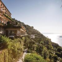 a house on a hill next to the ocean at Splendido, A Belmond Hotel, Portofino