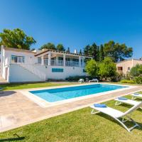 a villa with a swimming pool and lounge chairs at Villa Son Granada, Cala Blava