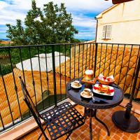 a balcony with a table with food on it at Eden Lilli B&B, La Pieve