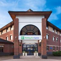 a brick building with a sign that reads hp holiday inn express at Holiday Inn Express Warwick - Stratford-upon-Avon, an IHG Hotel