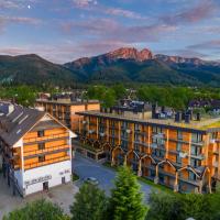 an aerial view of a city with mountains in the background at Bachleda Residence Zakopane