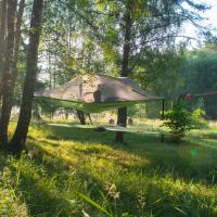a tent in a field in the woods at Naawa Nature Camp, Korppoo