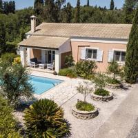 a house with a swimming pool in front of it at Villa Oleander, Áfra
