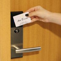 a person holding a piece of paper on a door at Asa Branca Hotel, Araripina