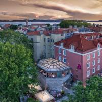 an aerial view of a city with a pink building at Bastion Heritage Hotel - Relais & Châteaux, Zadar