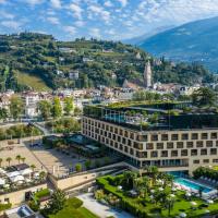 an aerial view of a city with mountains in the background at Hotel Therme Meran - Terme Merano