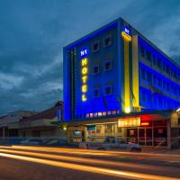 a building with a blue sign on the side of it at N1 Hotel Bulawayo
