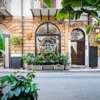 a building with a door with plants in front of it at Porta di Castro Boutique Hotel, Palermo