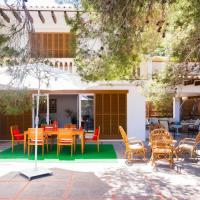 a patio with a table and chairs in front of a house at Finca Es Pi, Llucmajor