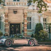 a silver car parked in front of a building at Grand Hotel Bellevue - adults only, Merano