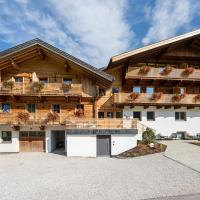 a large wooden house with balconies on it at Residence Alpina, Santa Maddalena
