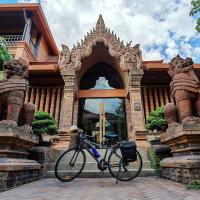 a bike parked in front of a building at Phor Liang Meun Terracotta Arts - SHA Extra Plus, Chiang Mai
