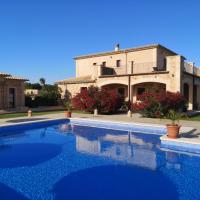 a villa with a swimming pool in front of a house at Finca Alegria - Agroturismo Son Sampoli, Llucmajor