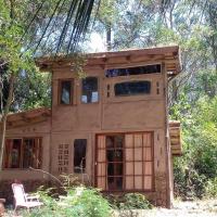 a small house in the middle of the woods at Casita Ecológica en el Bosque, Santa Ana