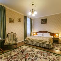 a bedroom with a bed and a chair at Sokol Hotel, Suzdal