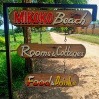 a sign that says mikoto beach ronos and chickens food and drinks at Mikoko Beach & Cottages, Bagamoyo