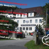 a sign in front of a white house at Hotel Burgwald, Passau