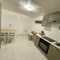 Appartement dans maison à Corbelin proche Walibi, מלון בCorbelin