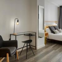 a hotel room with a bed and a chair at Hostal Arriazu, Pamplona