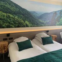a bedroom with two beds and a painting of a mountain at Best Western Plus La Fayette Hotel et SPA, Épinal