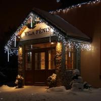 a building with a sign that reads vita pizza with lights at Vila Fenix B&B, Ružomberok