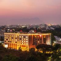 a building with a view of a city at night at Welcomhotel by ITC Hotels, RaceCourse, Coimbatore