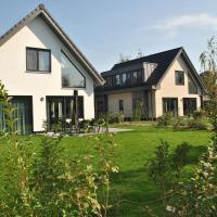 a house with a black roof at Luxurious Holiday Home in Texel with Terrace, Westermient