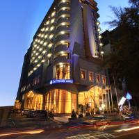 a large building with lights on the side of a street at Sapphire Addis, Addis Ababa